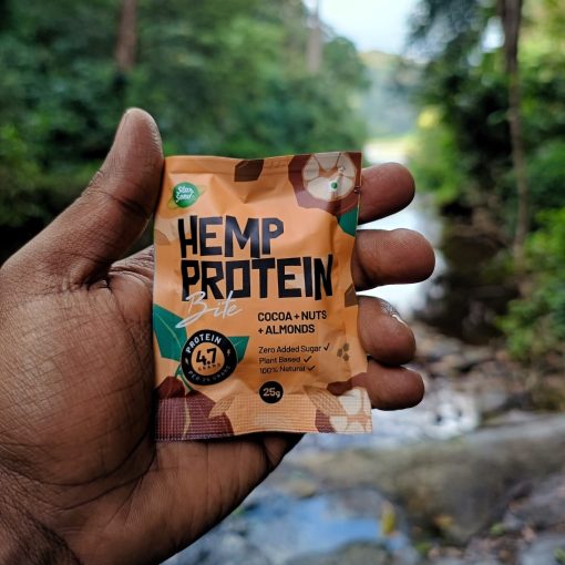 Hemp Protein Bites Coco flavor and a scenic water flowing background